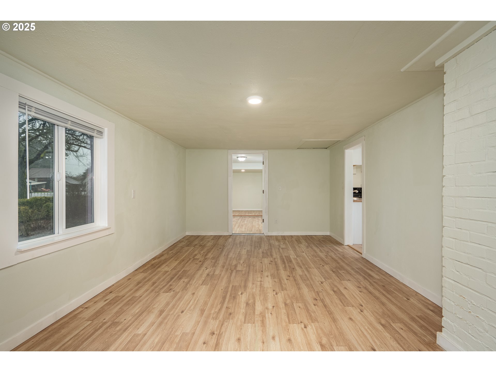 30045 Highway 99E Shedd, OR 97377 - Photo 17 of 37 a view of an empty room with wooden floor and a window