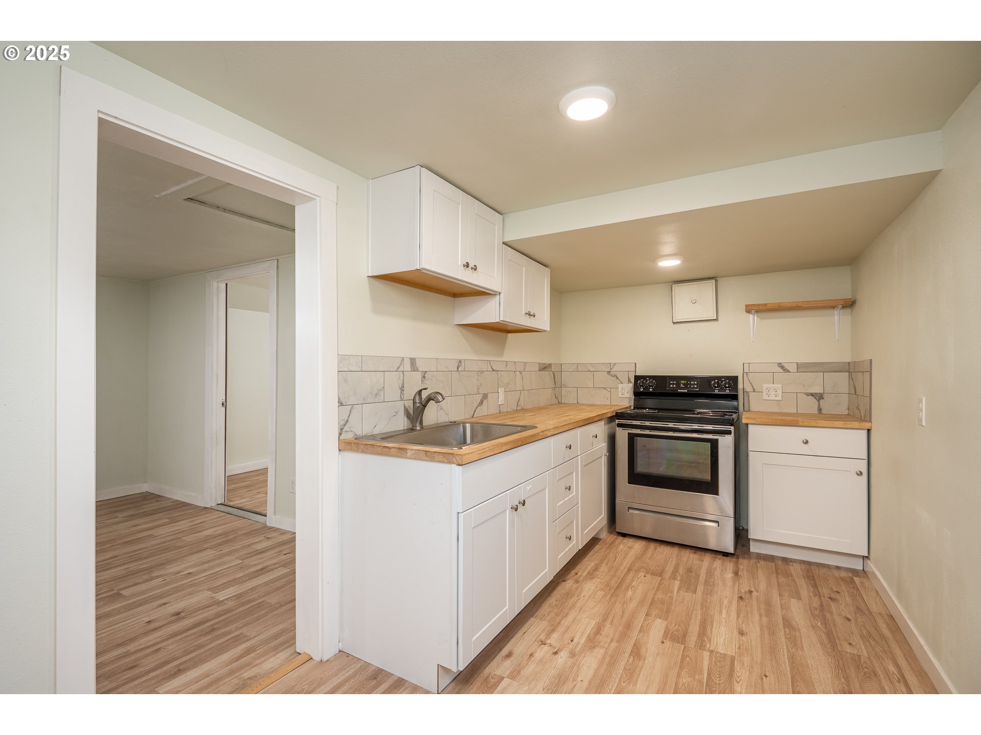 30045 Highway 99E Shedd, OR 97377 - Photo 8 of 37 a kitchen with a sink and a stove top oven