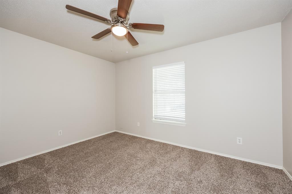 600 Dayton Road Mansfield, TX 76063 - Photo 11 of 18 an empty room with a window and a fan