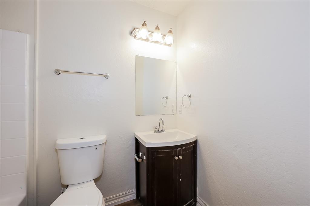 600 Dayton Road Mansfield, TX 76063 - Photo 16 of 18 a bathroom with a toilet sink and mirror