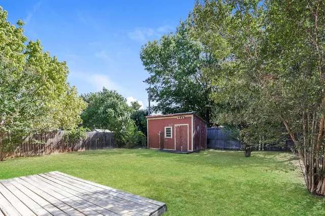 a backyard of a house with lots of green space