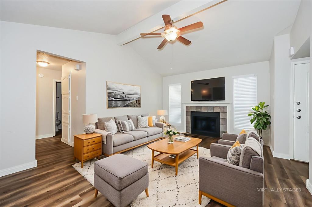 600 Dayton Road Mansfield, TX 76063 - Photo 4 of 18 a living room with furniture a fireplace and a flat screen tv