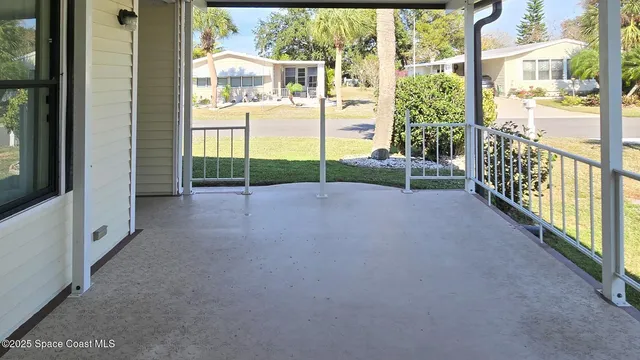 a view of a room with floor to ceiling windows