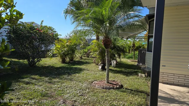 a backyard of a house with lots of green space