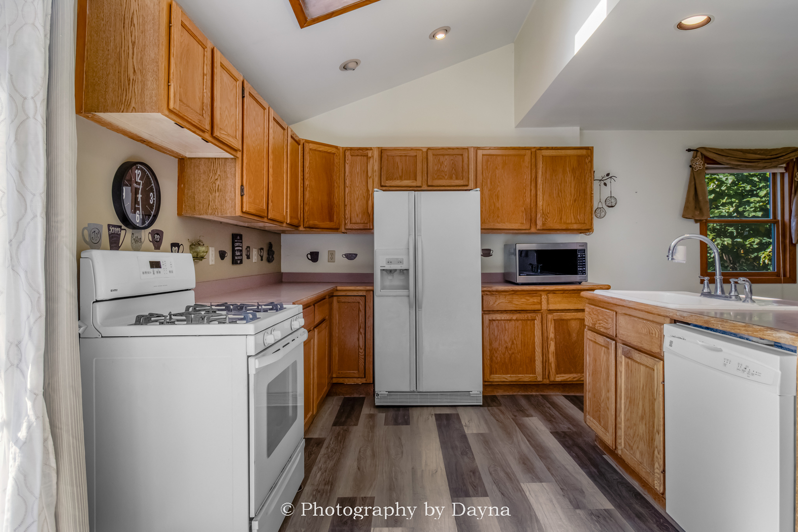 274 West Sheffield Street St. Anne, IL 60964 - Photo 2 of 32 a kitchen with a sink a stove cabinets and a refrigerator