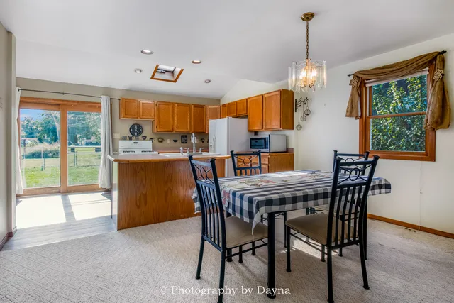 a dining room filled with furniture and window