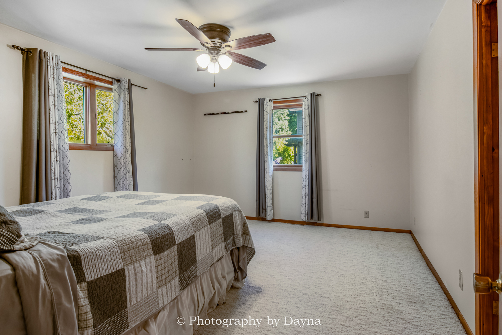 274 West Sheffield Street St. Anne, IL 60964 - Photo 9 of 32 a bedroom with a bed and a chandelier