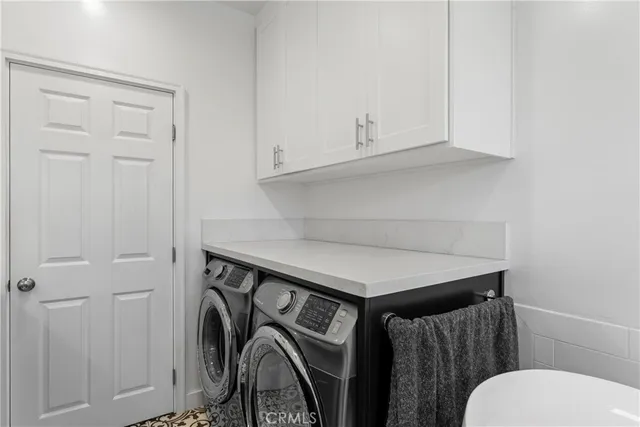 a bathroom with a toilet a sink and a mirror