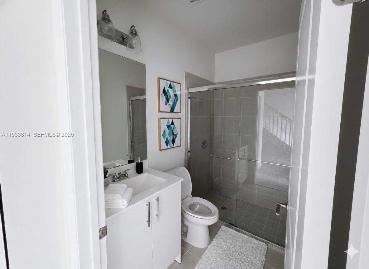 1082 Southeast 2nd Terrace, Unit 57 Homestead, FL 33034 - Photo 3 of 12 a bathroom with a sink toilet and shower