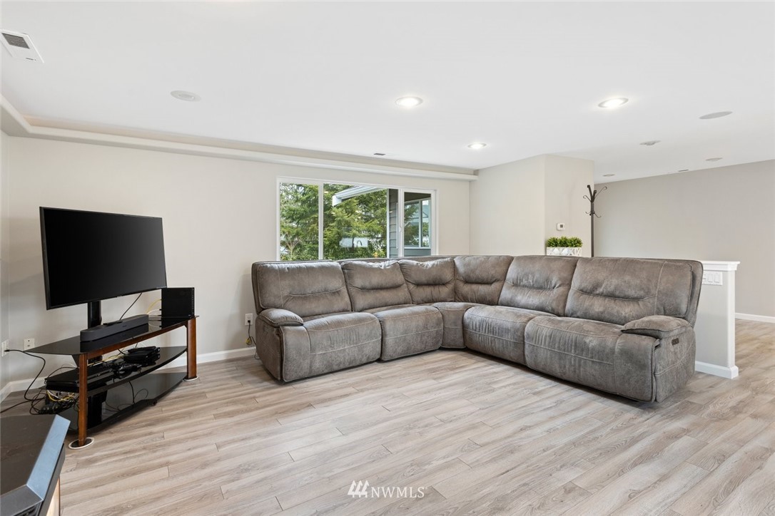 17255 Southeast 142nd Street Renton, WA 98059 - Photo 3 of 26 a living room with furniture and a flat screen tv