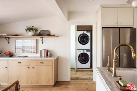 a view of a kitchen with a sink and cabinets