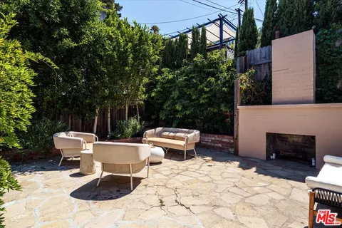 a view of a patio with a chairs and table in the patio