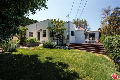 a house view with a garden space