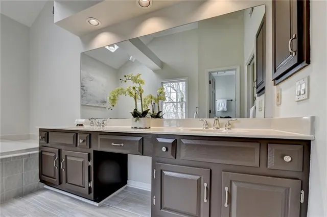 a view of a kitchen with a sink and stove top oven