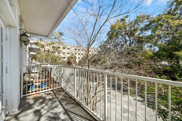 a view of balcony with wooden floor