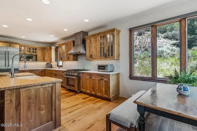 a kitchen with sink cabinets and wooden floor