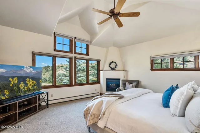 a bedroom with a bed and a fireplace