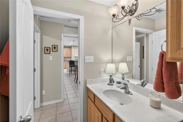 a bathroom with a double vanity sink mirror and shower