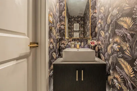 a bathroom with a sink and mirror