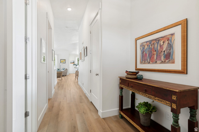 683 Kings Landing Tooele, UT 84074 - Photo 13 of 39 Hallway featuring light wood-finish flooring, white walls, recessed lighting, and white baseboards