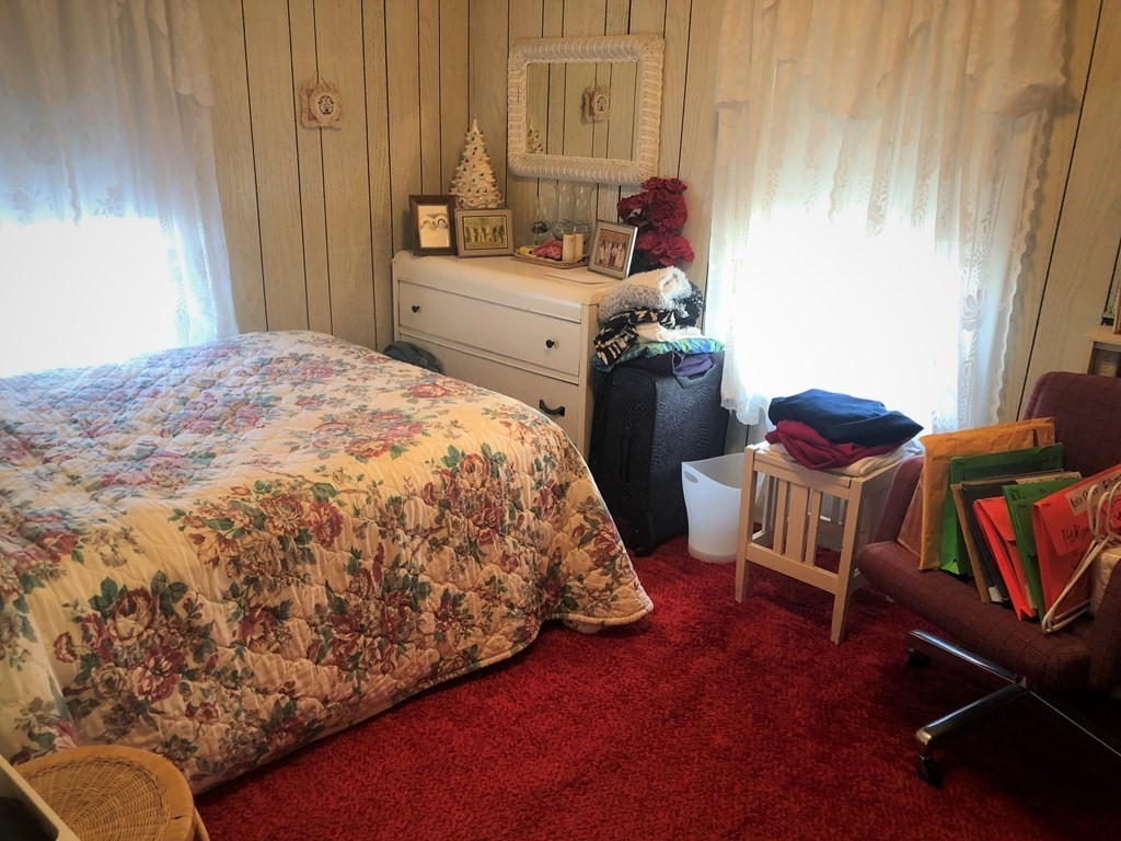103 Turner Road Scituate, MA 02066 - Photo 10 of 15 a bedroom with a bed and a chair