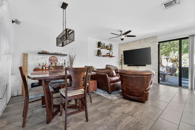 a view of a livingroom with furniture and a flat screen tv