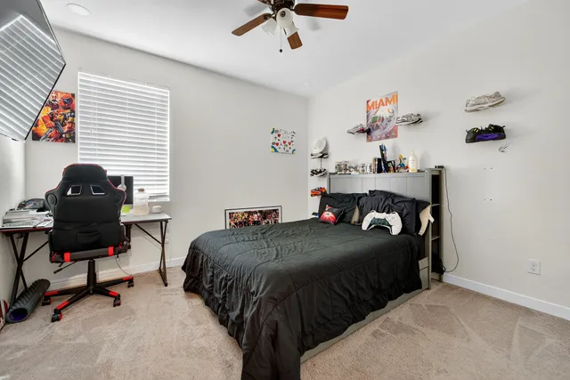 a bedroom with a bed and a chair