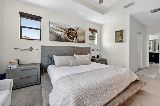 a bedroom with a bed and a couch