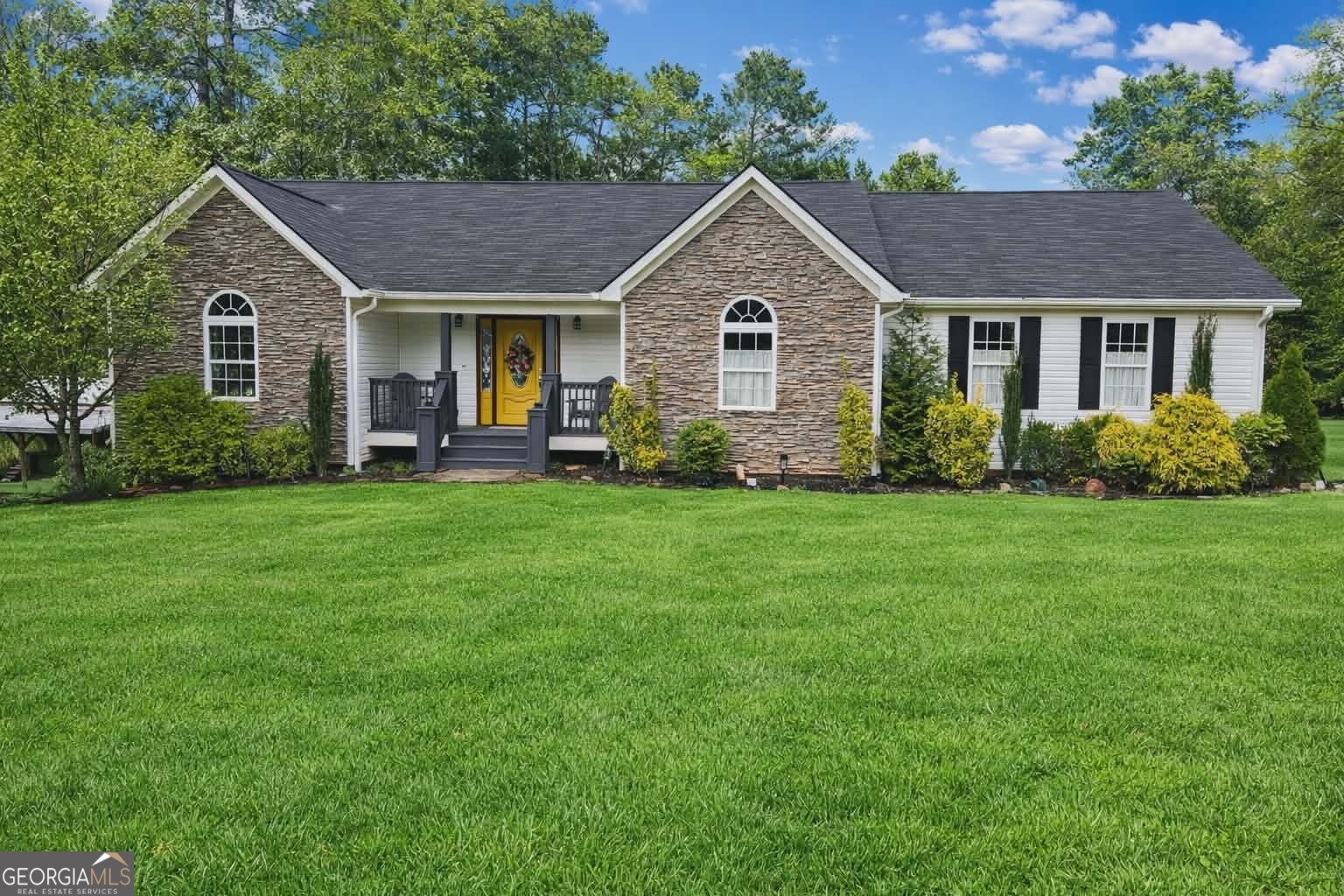 3020 Shoal Creek Road Monroe, GA 30656 - Photo 1 of 1 a front view of a house with a yard and trees