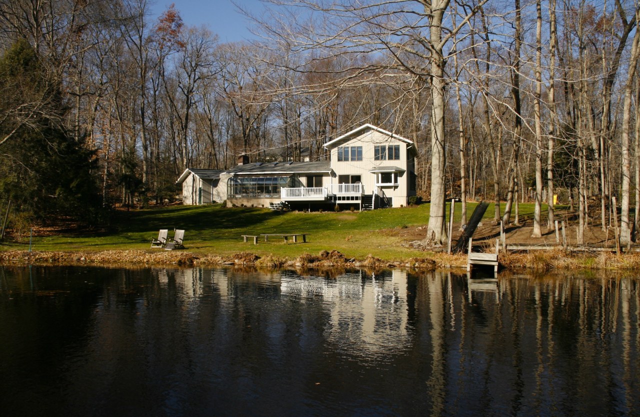 51 Journeys End Road New Canaan, CT 06840 - Photo 1 of 17 a house with swimming pool in front of it