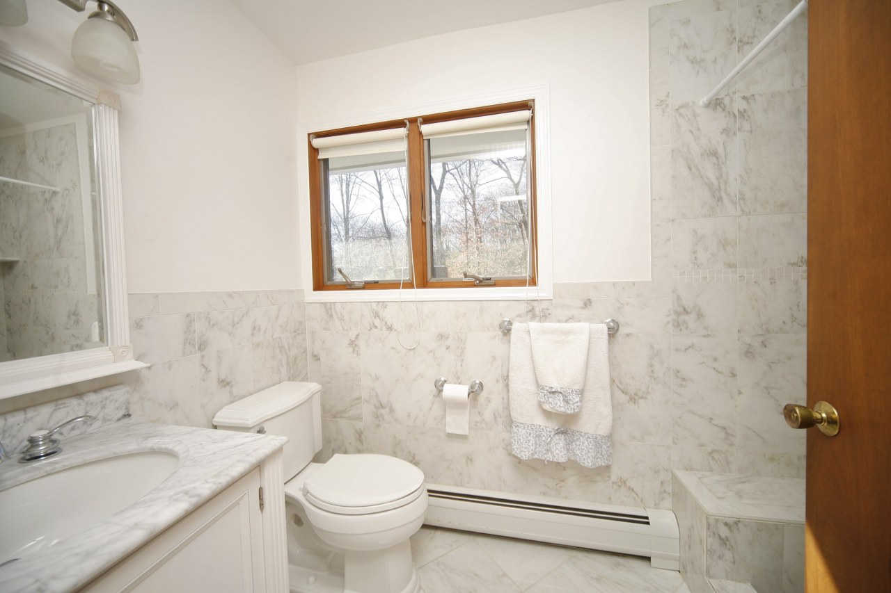 51 Journeys End Road New Canaan, CT 06840 - Photo 12 of 17 a bathroom with a sink toilet and shower