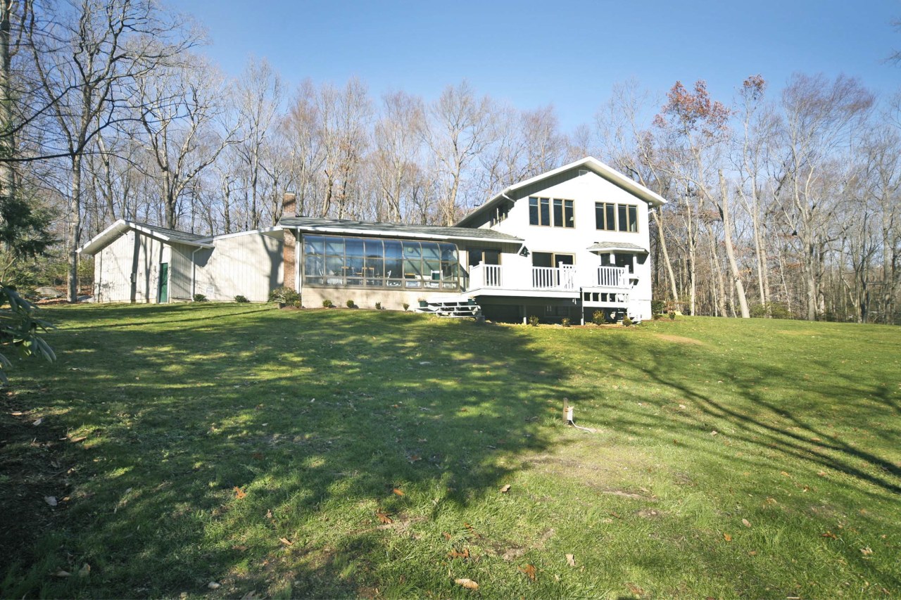 51 Journeys End Road New Canaan, CT 06840 - Photo 15 of 17 a house view with a garden space