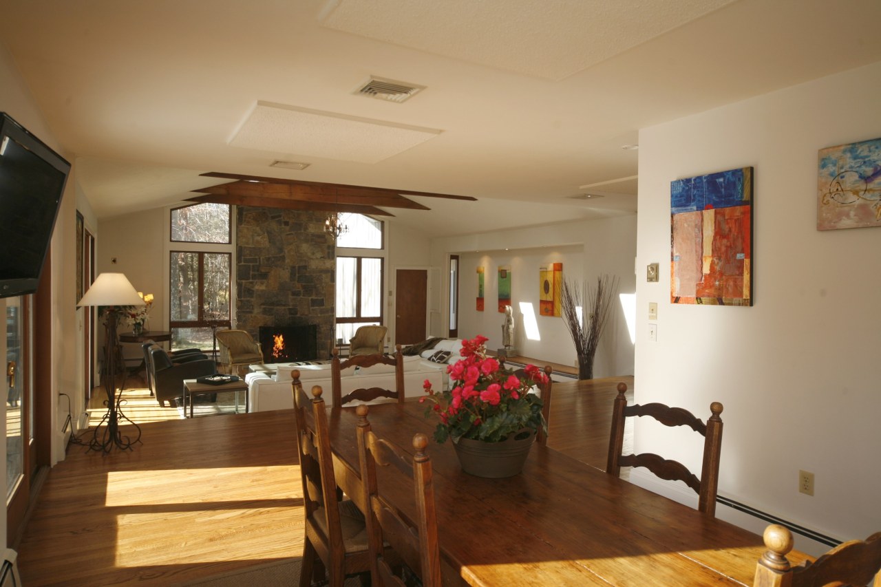 51 Journeys End Road New Canaan, CT 06840 - Photo 4 of 17 a view of a dining room with furniture and chandelier
