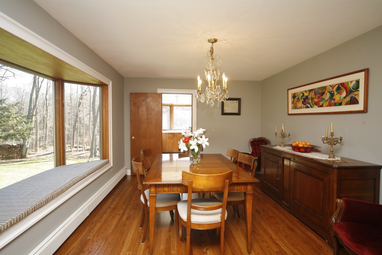 51 Journeys End Road New Canaan, CT 06840 - Photo 8 of 17 a view of a dining room with furniture a chandelier and wooden floor