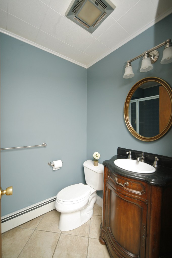 51 Journeys End Road New Canaan, CT 06840 - Photo 9 of 17 a bathroom with a sink a toilet and a mirror