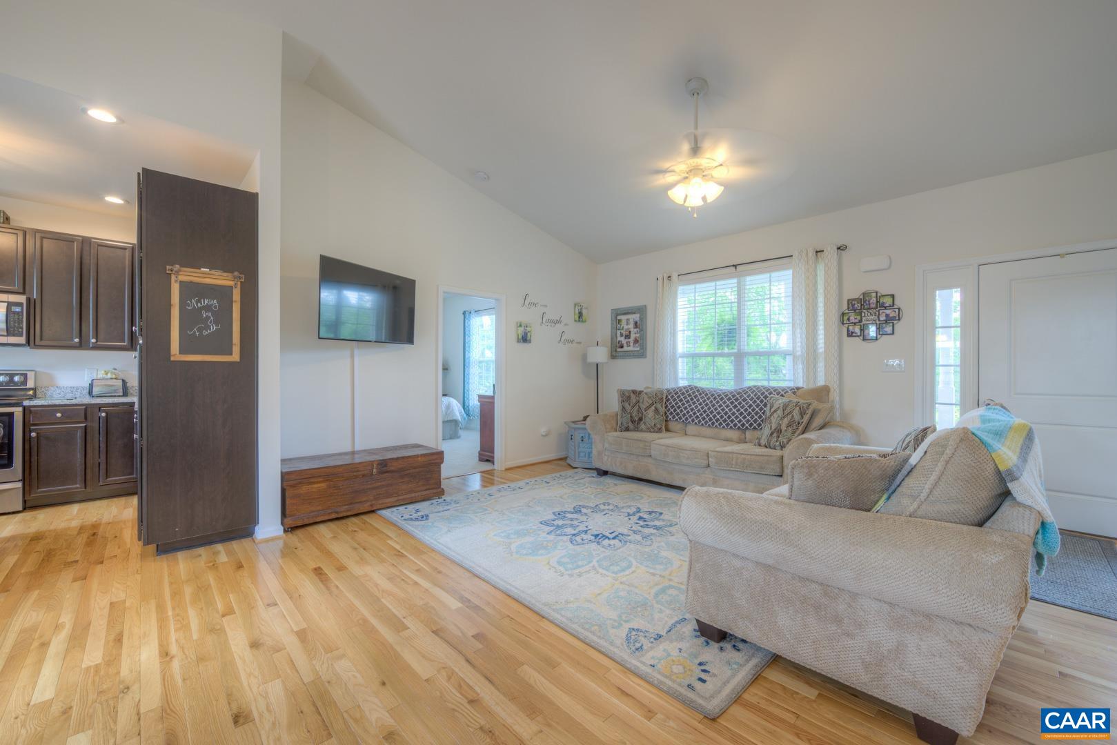 205 Cedar Run Road Ruckersville, VA 22968 - Photo 12 of 39 a living room with furniture and a flat screen tv