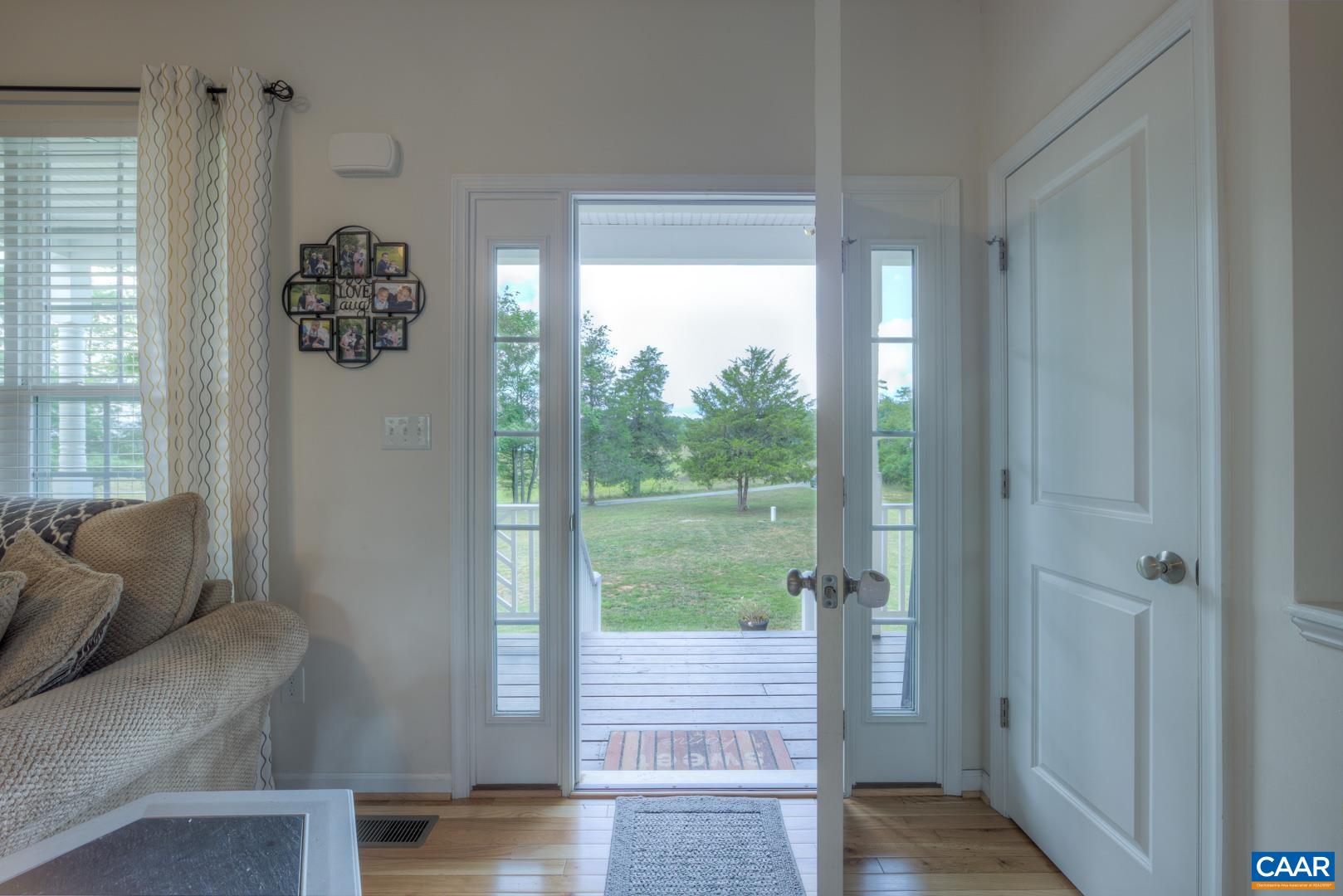 205 Cedar Run Road Ruckersville, VA 22968 - Photo 10 of 39 a living room with furniture and a large window