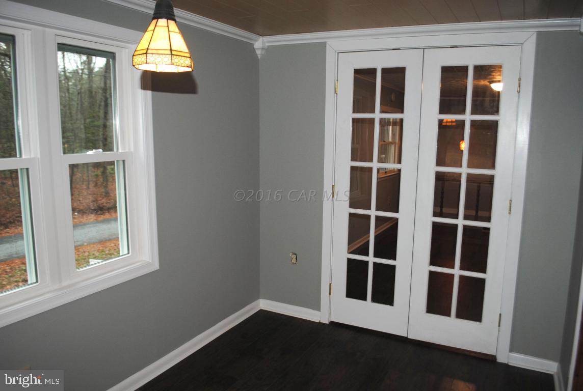 31140 McCormick Swamp Road Princess Anne, MD 21853 - Photo 8 of 20 a view of empty room with windows