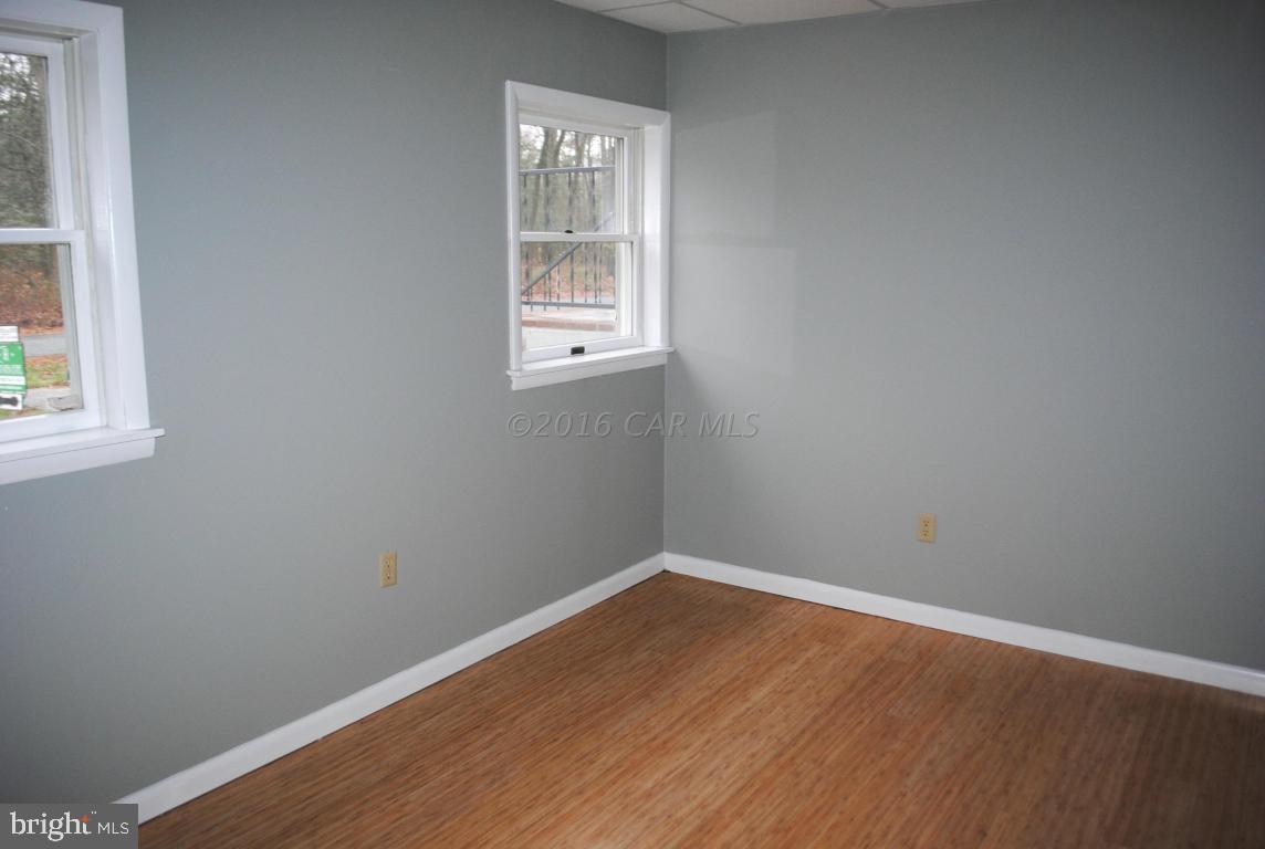 31140 McCormick Swamp Road Princess Anne, MD 21853 - Photo 9 of 20 an empty room with a window
