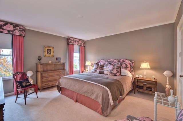 a bathroom with a mirror a sink and a shower