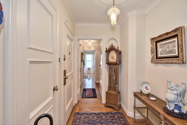 a kitchen with stainless steel appliances a sink a stove a refrigerator and cabinets