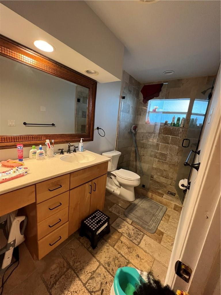 1250 East Sample Road, Unit 208 Pompano Beach, FL 33064 - Photo 9 of 19 a bathroom with a sink a toilet and shower