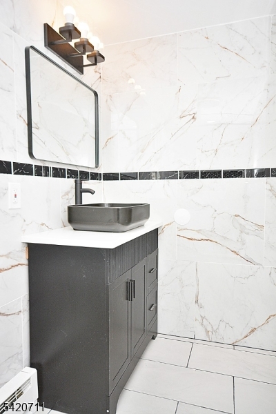1324 George Street Plainfield, NJ 07062 - Photo 23 of 26 a bathroom with a sink and a mirror