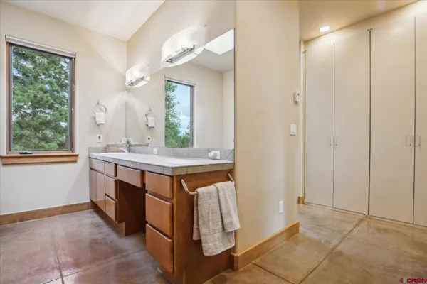 a view of a bathroom with a window and a sink