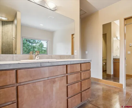 a bath tub sitting in a bathroom next to a window