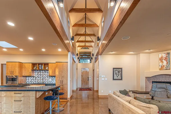 a living room with a couch and a chandelier