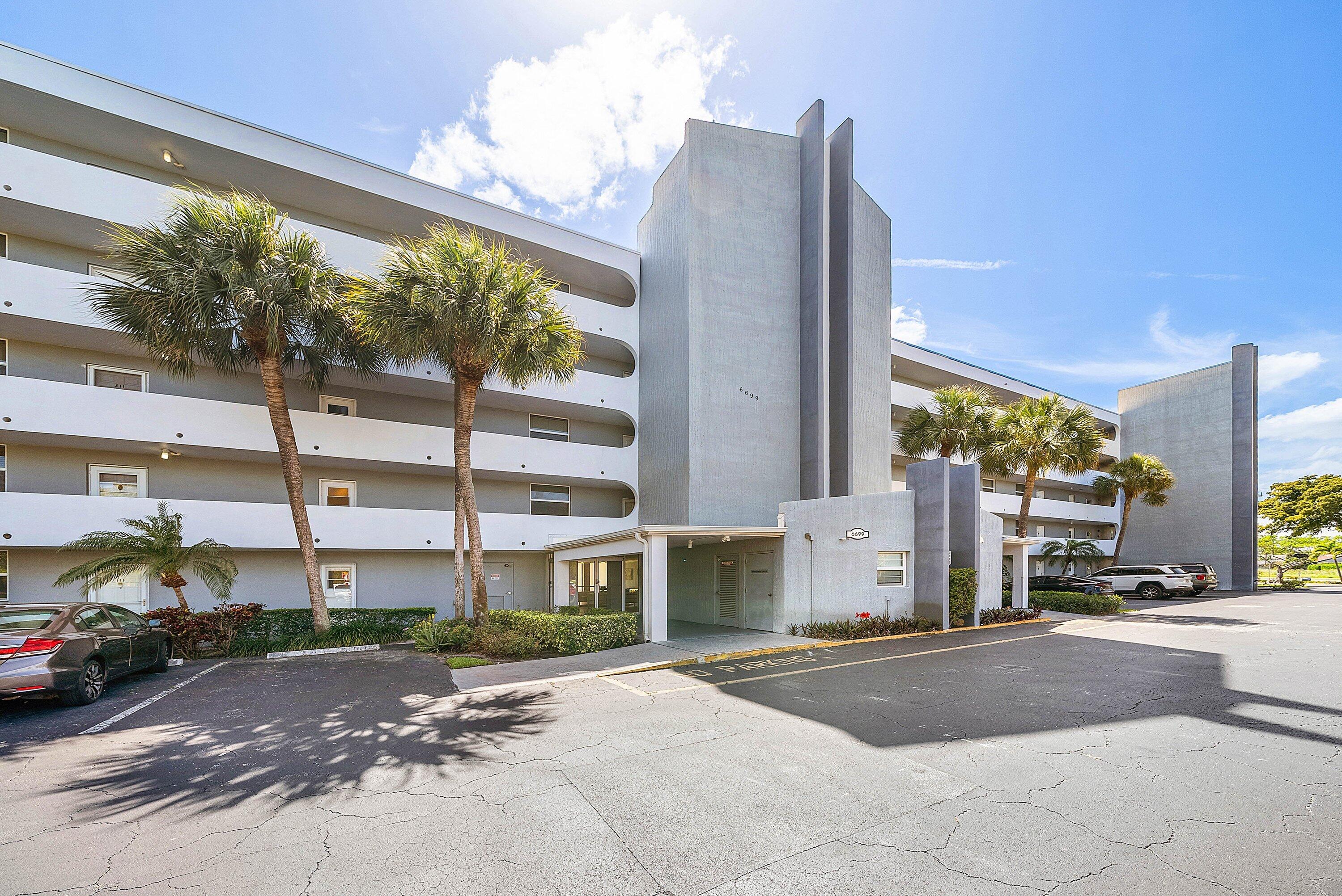 6699 Northwest 2nd Avenue, Unit 415 Boca Raton, FL 33487 - Photo 2 of 27 a view of a street with a building in the background