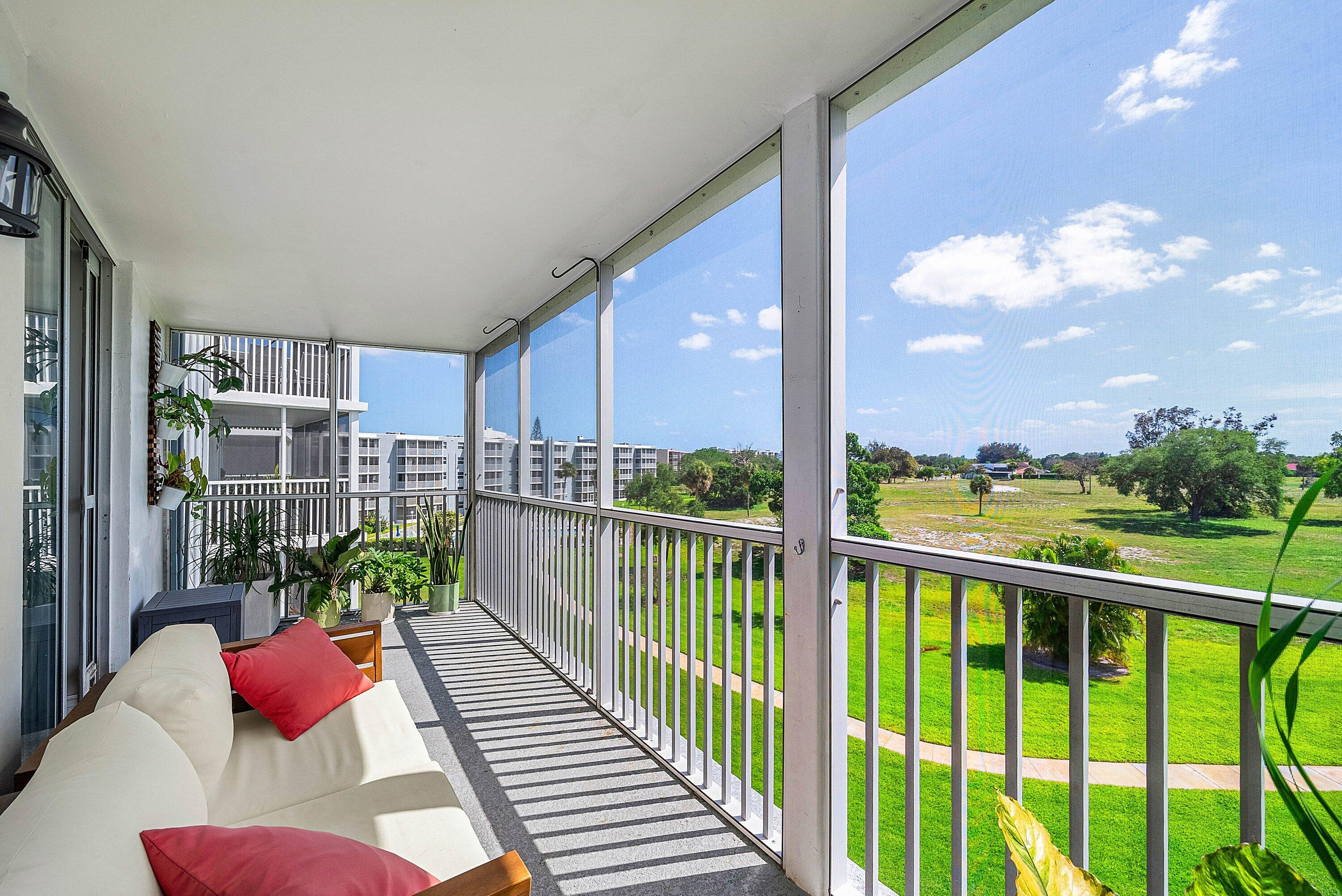 6699 Northwest 2nd Avenue, Unit 415 Boca Raton, FL 33487 - Photo 22 of 27 a balcony with chairs