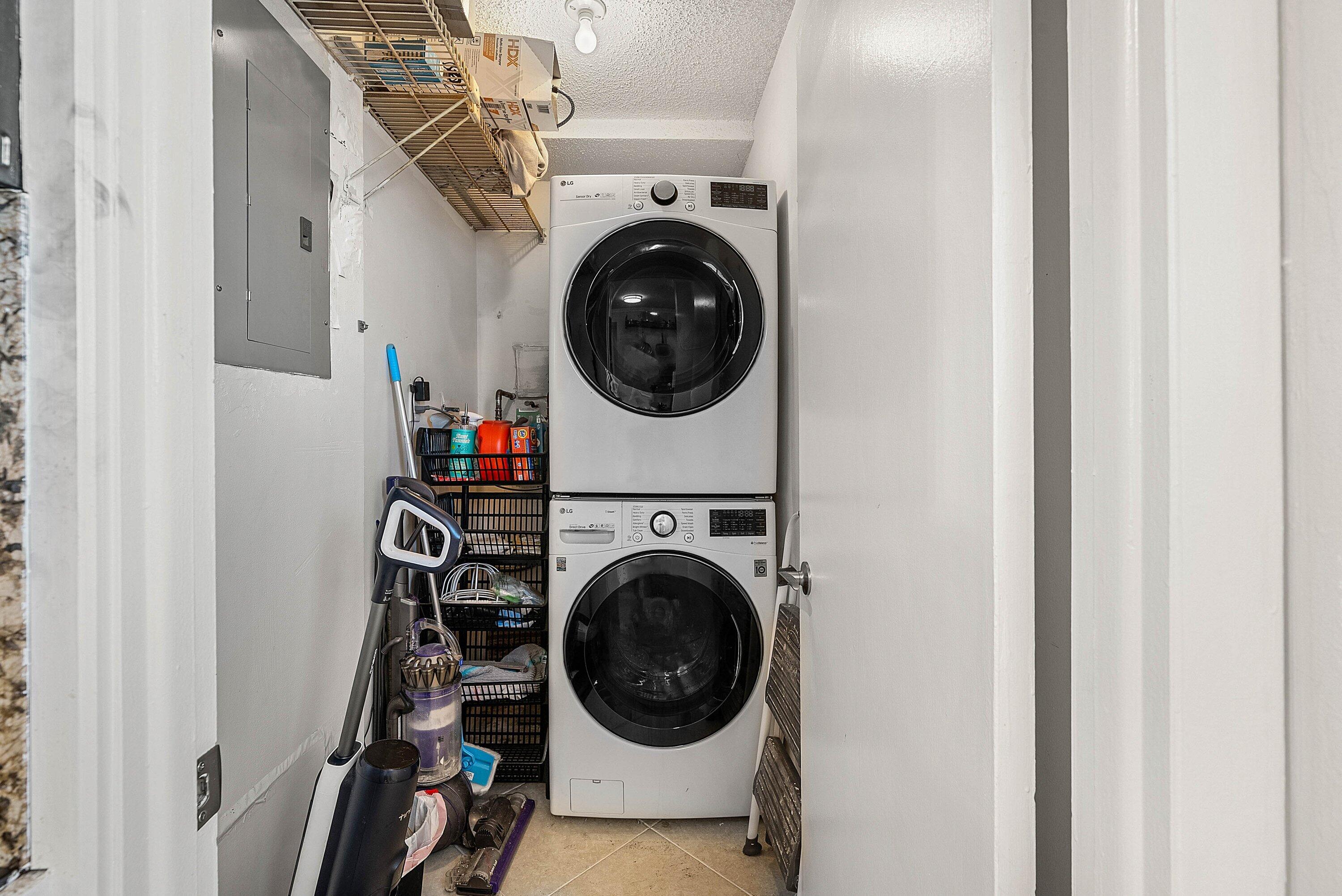 6699 Northwest 2nd Avenue, Unit 415 Boca Raton, FL 33487 - Photo 8 of 27 a view of a hallway with washer and dryer