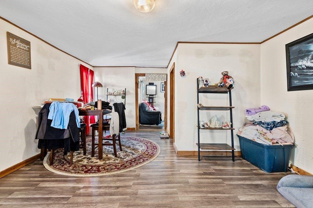 19 Myrtle Avenue Webster, MA 01570 - Photo 14 of 42 a living room with furniture and a wooden floor